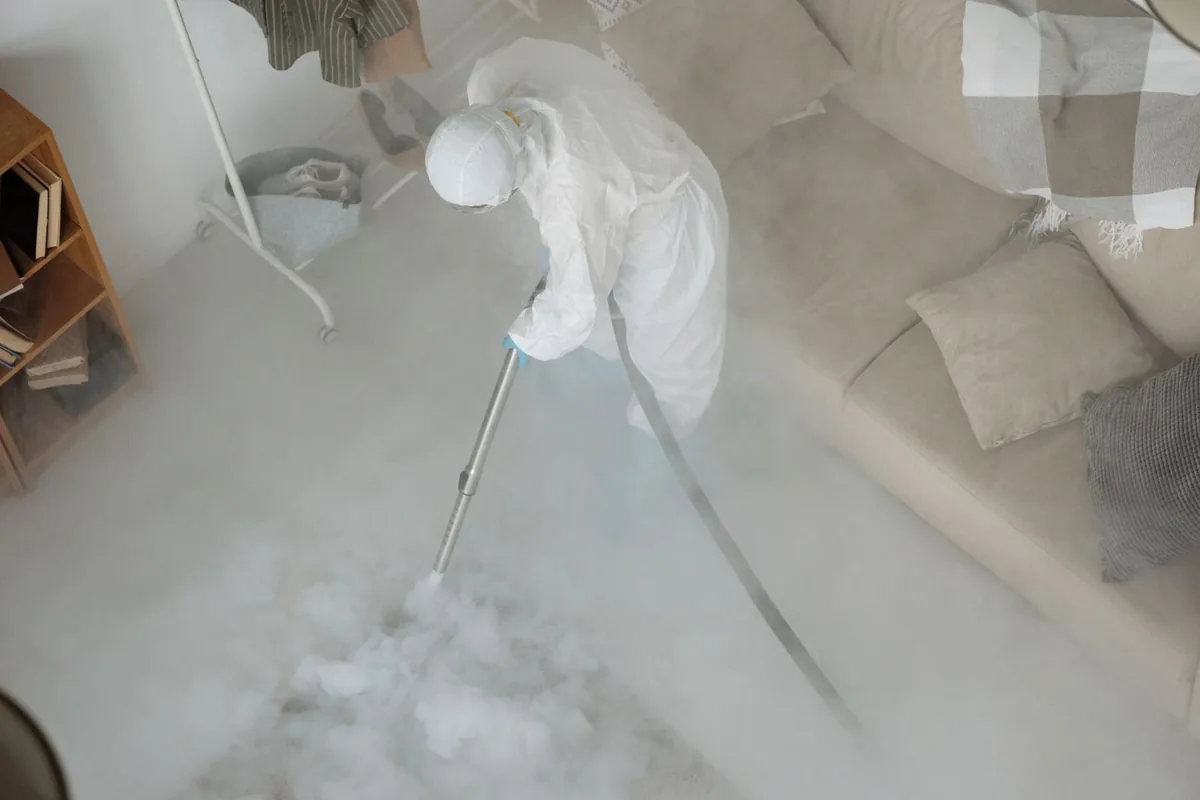 Biohazard cleanup technician in protective equipment, Fort Morgan, CO
